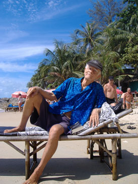 chris on sunbed on beach in Koh Samui